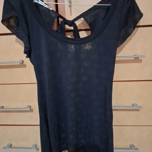 Backless blouse like new, black, with light transparency and embossed designs