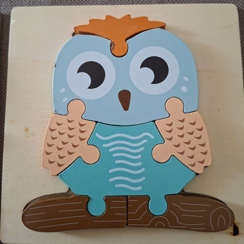 Wooden puzzles for children used, owl and elephant