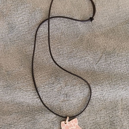 Necklace new with black elastic and silver ornament with pink details