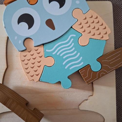 Wooden puzzles for children used, owl and elephant