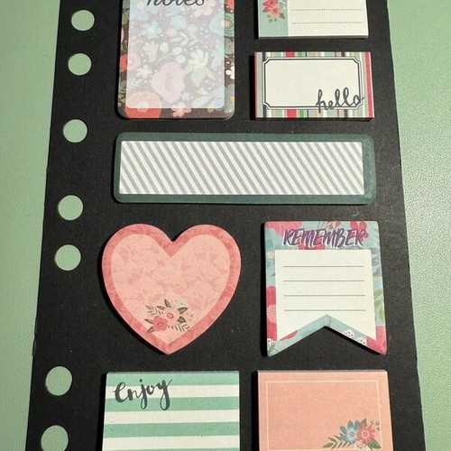 Stationery set with notebook, pen, highlighters, clips, and post-it notes