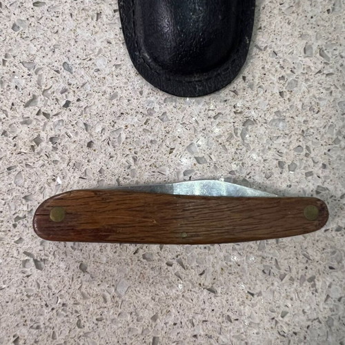 Folding knife used from 1980s with sheath