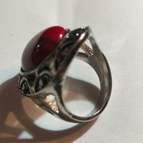 Silver-plated ring with red stone and small crystals new