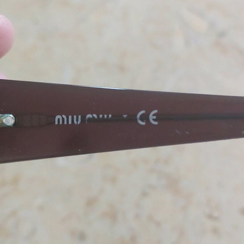 Miu Miu eyeglasses used with purple and orange acetate frame