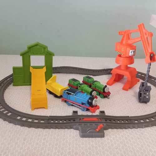 Thomas The Tank Engine train set like new with tracks, three trains, crane, and slide