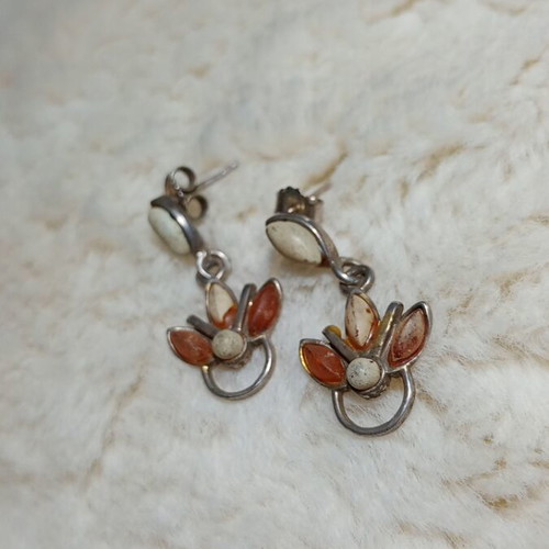 Silver earrings with amber used