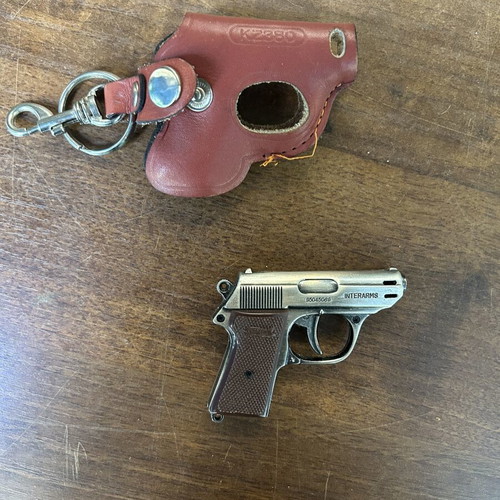 Gun-shaped lighter with case