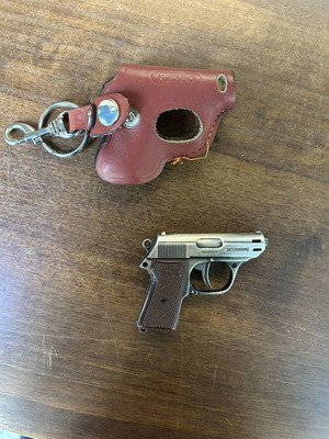 Gun-shaped lighter with case