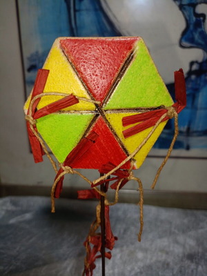 Handmade hexagonal kite sculpture by S. Trigoni, ceramic base
