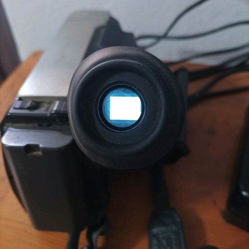 Hitachi video camera used with foldable screen and VHS cassette