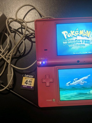 Nintendo DSi used dark pink with charger and 4GB SD card