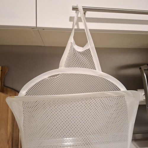 Foldable mesh storage basket white used for laundry and toys