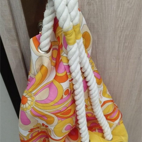 Clinique shoulder bag like new, colorful, cylindrical shape