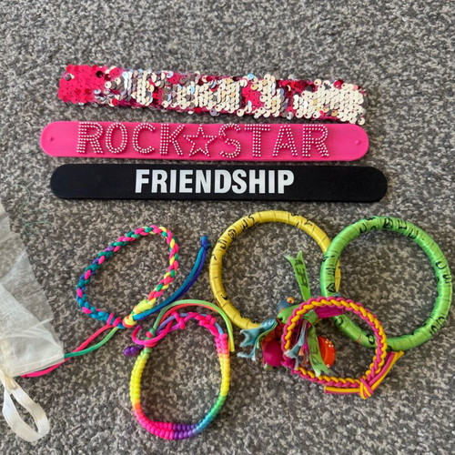 Children's jewelry used, colorful bracelets and pendants