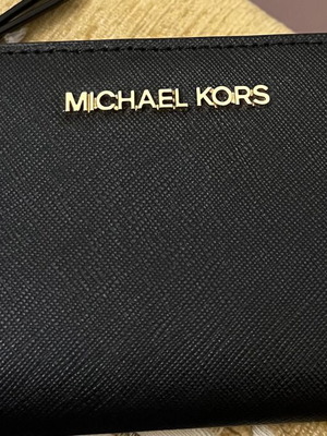 Michael Kors black wallet new with card slots and zipper coin pocket