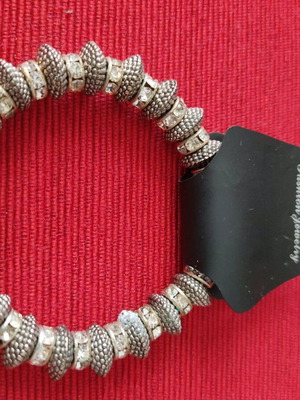 Metal elastic bracelet like new, silver with rhinestones