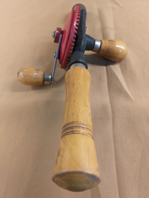 Vintage hand drill used with wooden handle