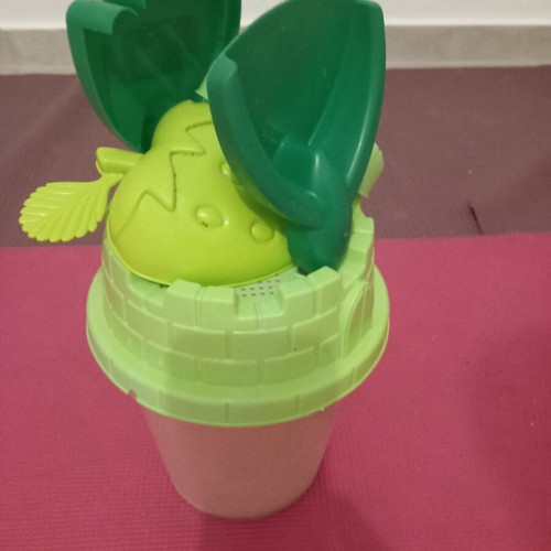 Children's beach bucket set used with shovel, rake and crocodile mold