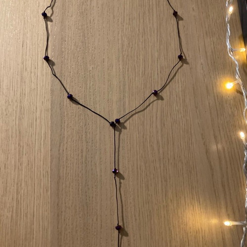 Necklace with purple beads like new, long with black cord