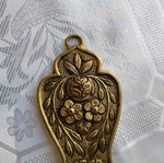 Brass decorative item like new with intricate carvings 24 cm long