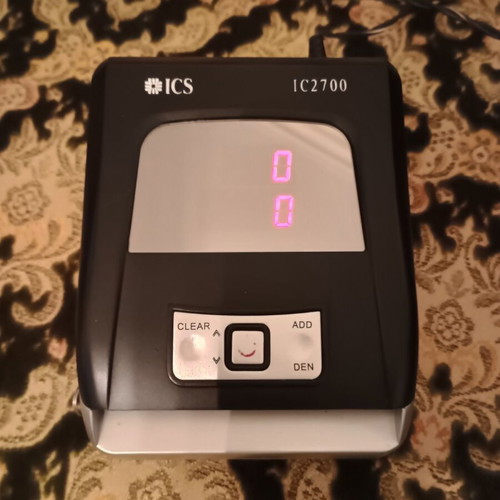 Digital money counter used with counterfeit detection