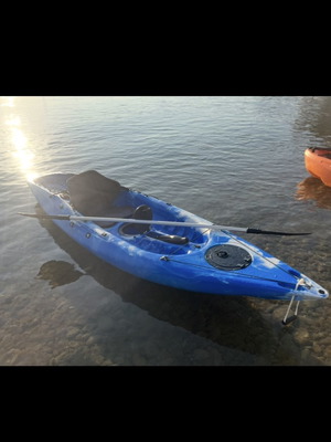 Plastic sea canoe used with two rod holders and waterproof storage