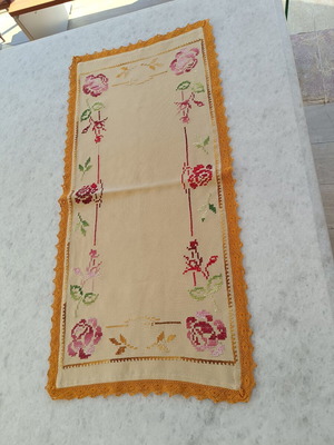 Vintage handmade table runner with cross-stitch and lace, used