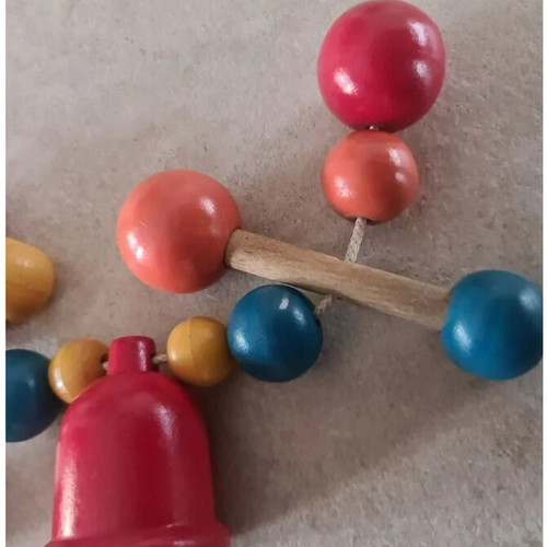 Vintage wooden stroller toy.