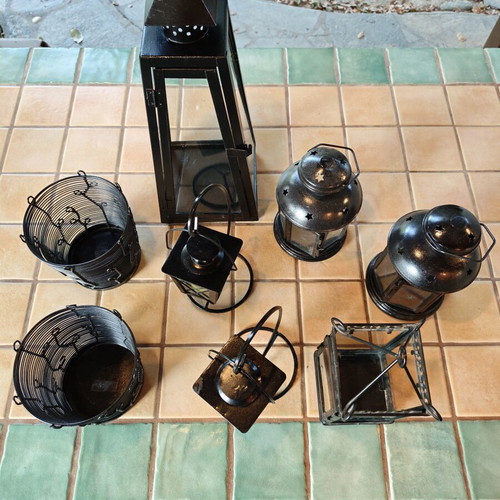 Set of eight lanterns and candle holders for garden decoration