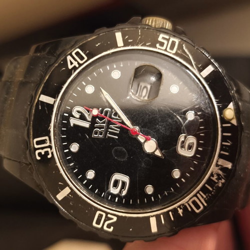 Black wristwatch used, needs battery