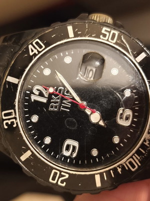 Black wristwatch used, needs battery