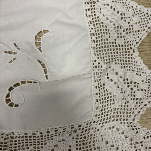 Handmade white tablecloth with cutwork embroidery and crochet lace, used