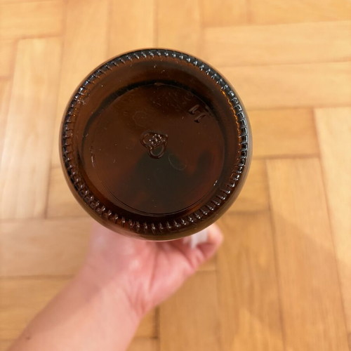 Brown glass pharmacy-style bottle with cap