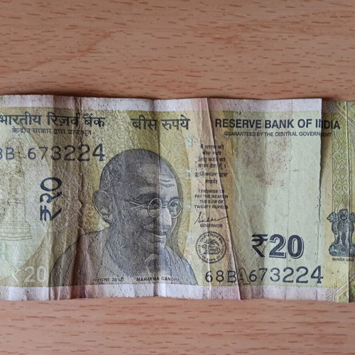 Indian 20 Rupees banknote used with tear
