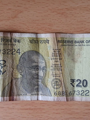 Indian 20 Rupees banknote used with tear