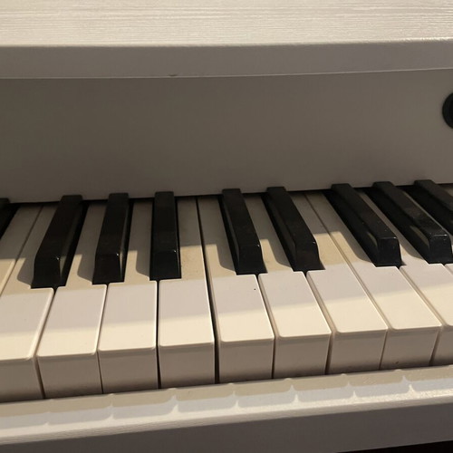 Children's Piano like new, wooden, battery operated