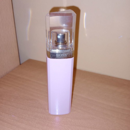 Empty Hugo Boss and Carolina Herrera perfume bottles collectible