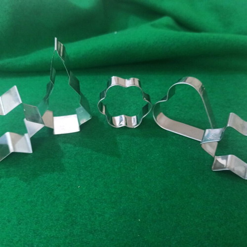 Cookie cutters with Christmas designs used