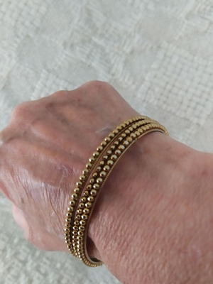Bracelets like new, set of three in gold color