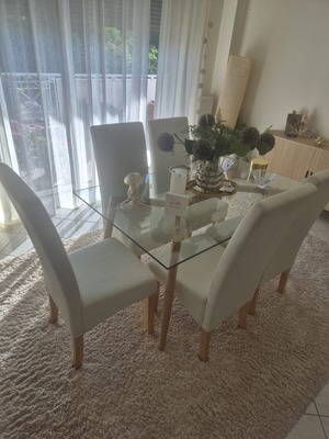 Dining set with 6 white leather chairs and table like new