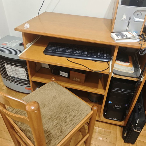 Computer desk with sliding keyboard shelf and wooden chair