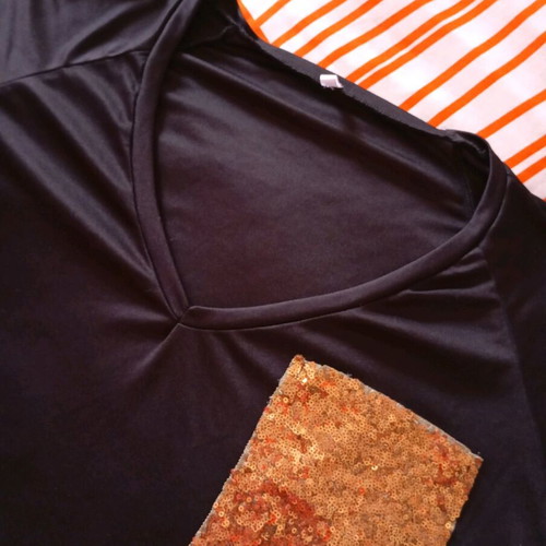 Black elastic blouse with sequin pocket and cutout, like new