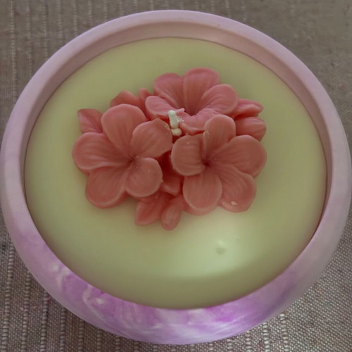 Handmade candle in plaster jar with flower new