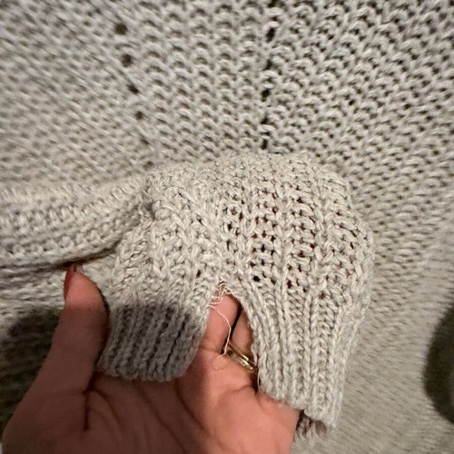 Gray sweater used, size M, with seam wear on sleeves