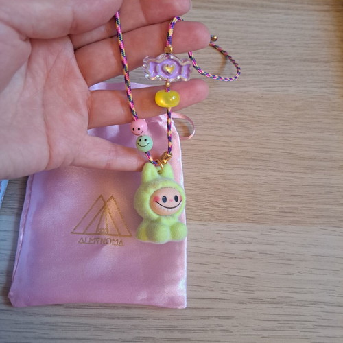 Labunoma necklace with colorful fuzzy smiling monster charm, like new