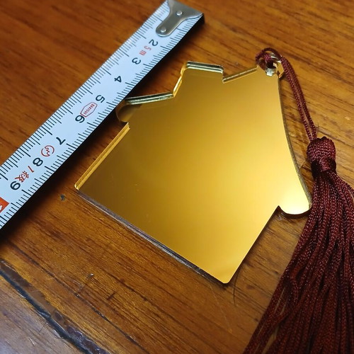 House-shaped plexiglass mirror charm new with burgundy tassel