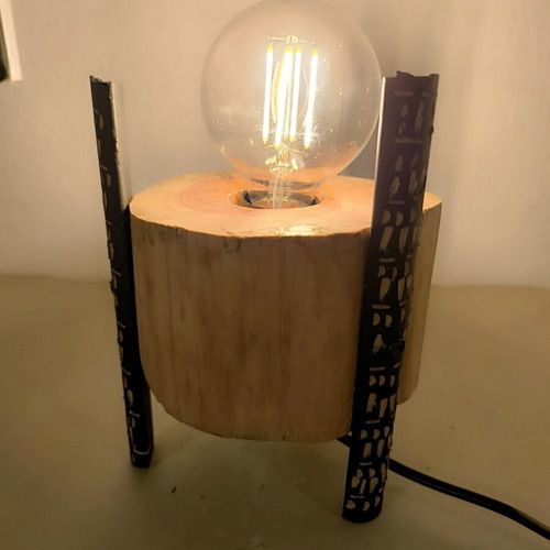 Handmade table lamp from solid wood trunk with carved black legs