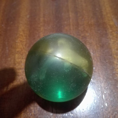 Vintage rubber ball used with transparent and blue colors and dolphin