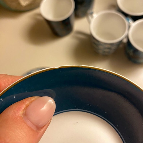 Coffee cup set used with one broken saucer