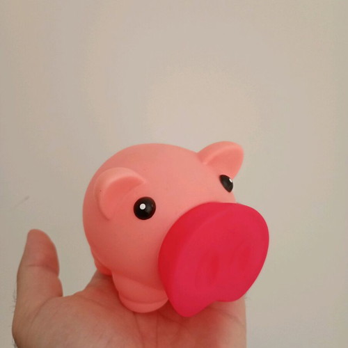 Piggy bank used, made of hard plastic
